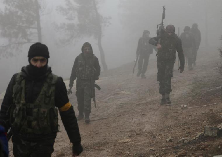Turkish-backed Free Syrian Army fighters are seen near Mount Barsaya, northeast of Afrin, Syria, January 23, 2018.