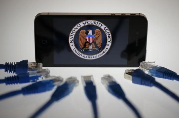 An illustration picture shows the logo of the U.S. National Security Agency on the display of an iPhone in Berlin, June 7, 2013.