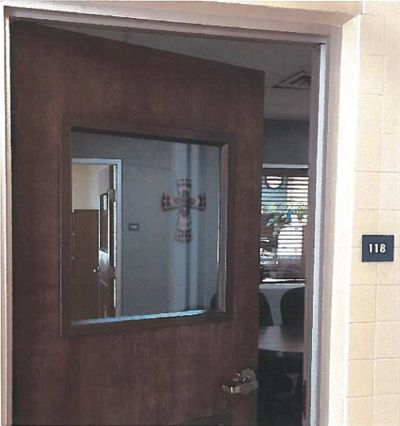 A cross hangs in an office on the campus of New Mexico Junior College in Hobbs, New Mexico in this undated picture.