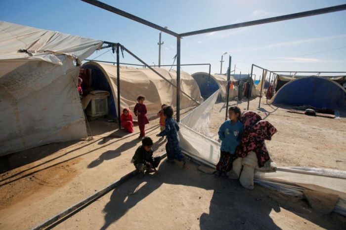 Displaced Iraqi children are seen at the Amriyat al Fallujah camp in Anbar Province, Iraq January 3, 2018.