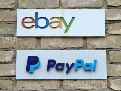 Signs are posted outside the offices of online marketplace eBay and its electronic payments division PayPal in Toronto.