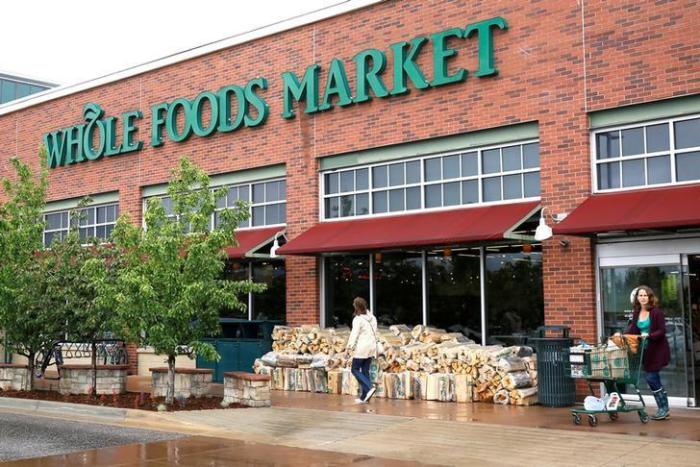 Customers leave the Whole Foods Market in Boulder, Colorado, U.S. on May 10, 2017.