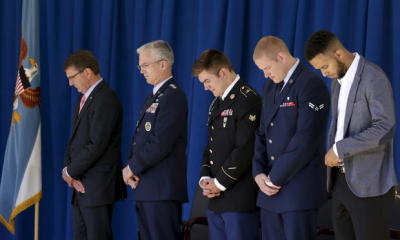 (From middle L-R) U.S. Army Specialist Alek Skarlatos, (Soldier's Medal), USAF Airman 1st Class Spencer Stone, (Airman's Medal and Purple Heart), and civilian Anthony Sadler bow their heads during the invocation prior to the awards for their roles in disarming a gunman on a Paris-bound train in Washington Sept. 17, 2015.