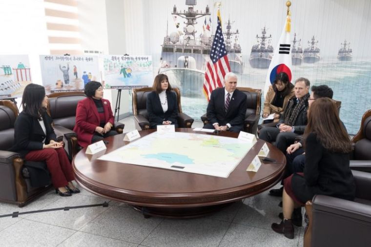 Vice President Mike Pence and his wife, Karen, in a meeting with Fred Warmbier, father of the late Otto Warmbier, and North Korean defectors in Pyeongchang, South Korea, February 9, 2018.