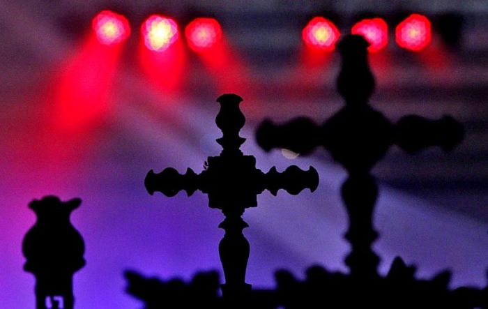 Catholics hold the holy cross while attending a mass as part of a three-day conclusion to the Holy Year celebrations at the La Vang Basilica, in Vietnam's central Quang Tri province January 5, 2011.