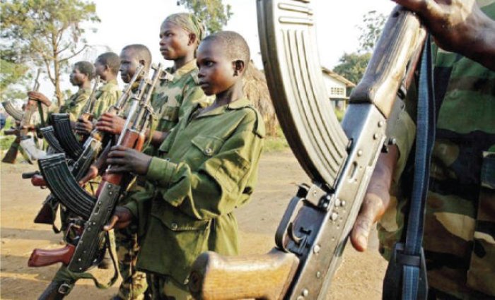 DR Congo child among soldiers holding weapons in this undated photo.