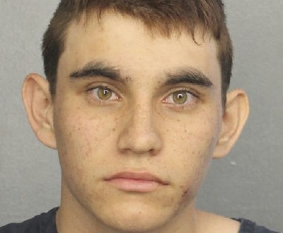 Florida school shooting suspect Nikolas Cruz, 19, was brought to the Broward County jail and charged with 17 counts of premeditated murder on Thursday February 15, 2018.