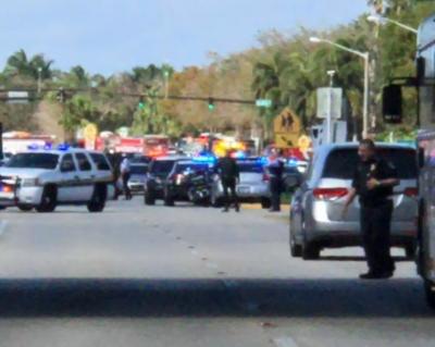 Police cars are seen in Coral Springs after a shooting at the Marjory Stoneman Douglas High School in Parkland, Florida, February 14, 2018, in this image obtained from social media.