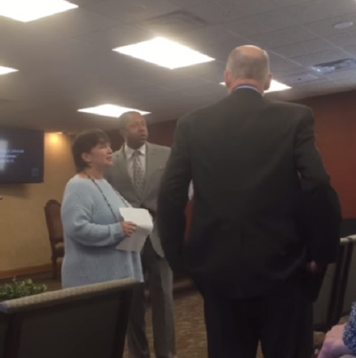 Joyce Taylor (L) crashes a service at the Union Lake Kingdom Hall in Michigan on Sunday February 18, 2018, to tell members they have blood on their hands for shunning her friend Lauren Stuart and her family. Lauren was found dead with her husband and two children by police in their home two days earlier.