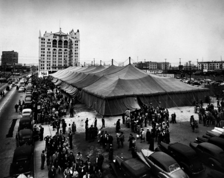 Crowds gather outside the "canvas cathedral" at the 1949 Billy Graham Crusade in Los Angeles where some 350,000 people heard Graham preach.
