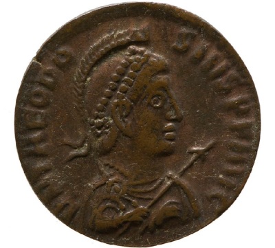 The front of a coin bearing the image of Roman Emperor Theodosius I, (347-395).