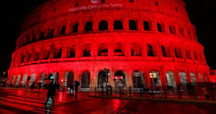 The Colosseum is lit up in red to draw attention to the persecution of Christians around the world in Rome, Italy, February 24, 2018.