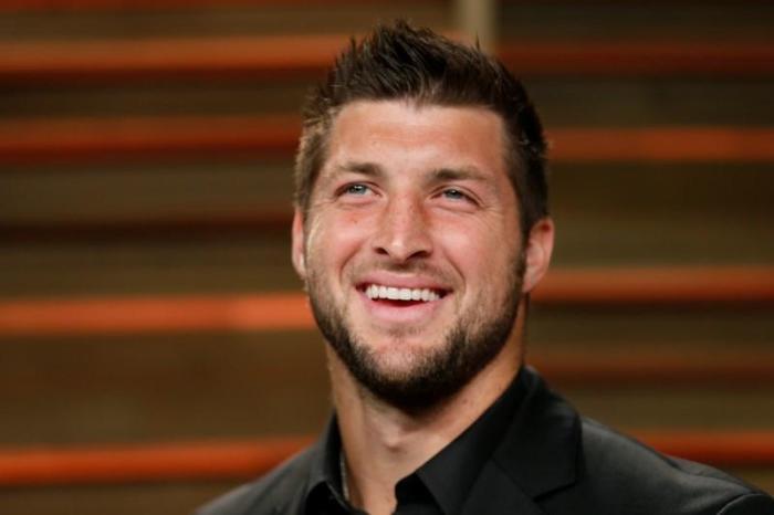 Former NFL player Tim Tebow arrives at the 2014 Vanity Fair Oscars Party in West Hollywood, California, U.S. on March 2, 2014.