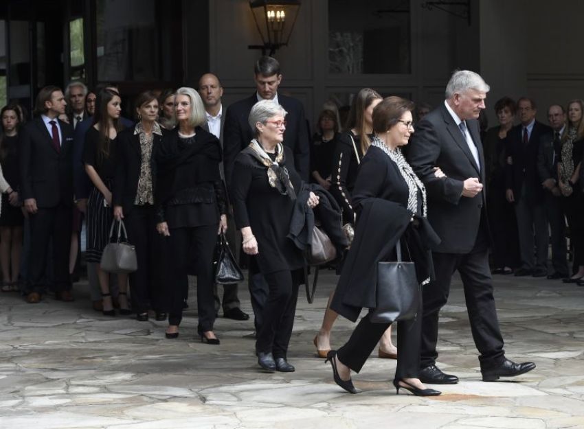 Family members, including Franklin Graham (R) and Anne Graham Lotz (center) walk to vehicles before the body of Rev. Billy Graham leaves the Billy Graham Training Center at the Cove on Saturday, Feb. 24, 2018, in Asheville, N.C.