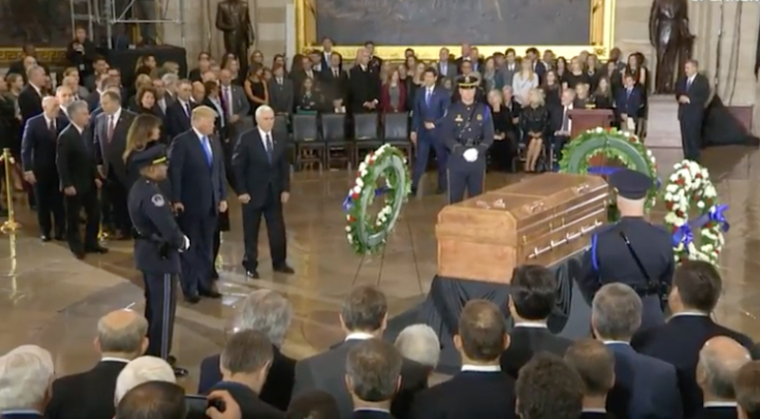 President Donald Trump, his wife, Melania, and Vice President Mike Pence pay their respects as Billy Graham lies in honor at the U.S. Capitol, Feb. 28, 2018.