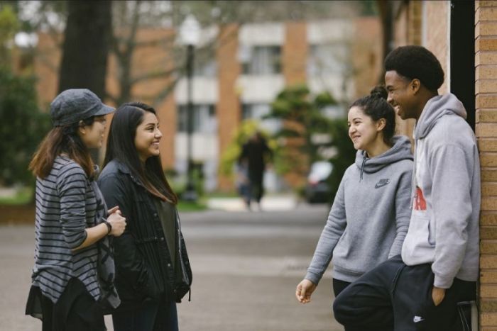 Students converse on the campus of George Fox University in Newberg, Oregon.
