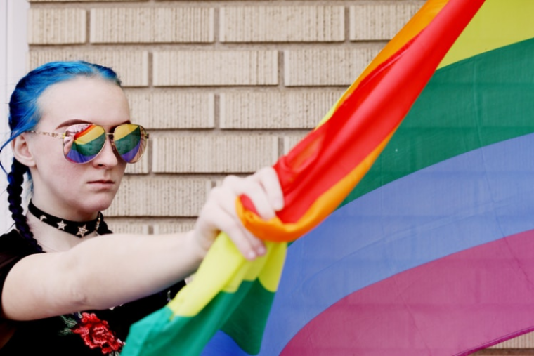 Woman with LGBTQ flag