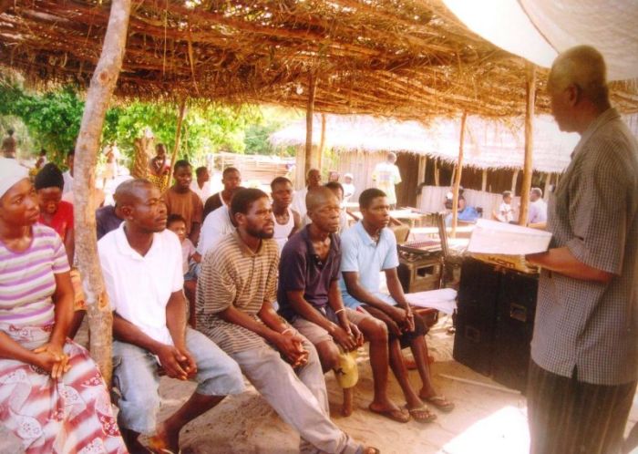 Pastor James Cuffee of Christ Evangelistic Fellowship Ministries in Liberia preaches to villagers in this undated photo.
