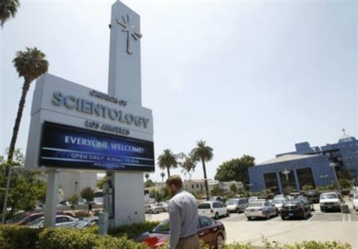 A man walks past the Church of Scientology of Los Angeles building in Los Angeles, California July 3, 2012.