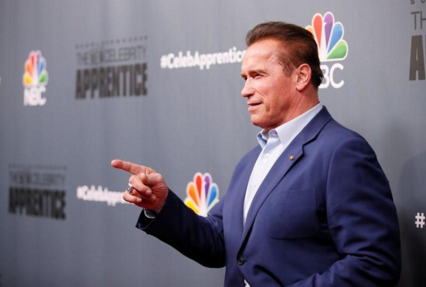 Host Arnold Schwarzenegger poses after a panel for "The New Celebrity Apprentice" in Universal City, California, December 9, 2016.