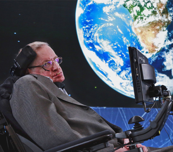 Stephen Hawking sits on stage during an announcement of the Breakthrough Starshot initiative with investor Yuri Milner in New York.