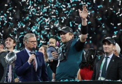 Philadelphia Eagles' Nick Foles celebrates winning Super Bowl LII with his daughter, Feb. 4, 2018.