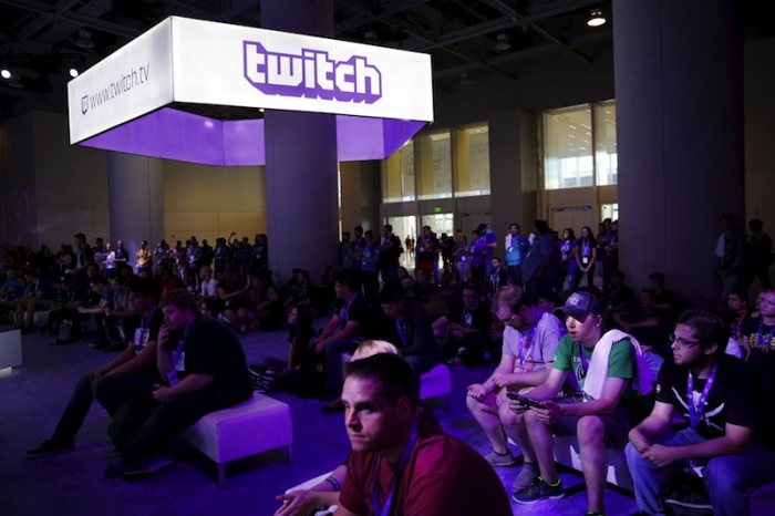 Audience members watch as panelists play video games at TwitchCon 2015 in San Francisco, California September 25, 2015. The conference features games, broadcasters and viewers, as well as gaming hardware and software.