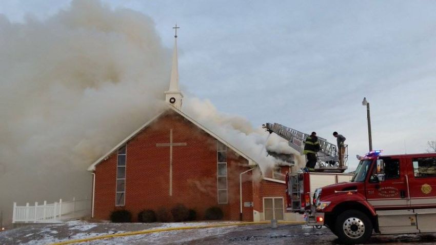 Firefighters work to put out a fire that destroyed the Antioch Baptist Church in Hannibal, Missouri on Dec. 20, 2016.