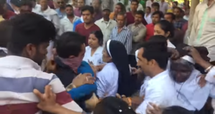 A mob assaults nuns at the Pushpa Mission Hospital in the temple town of Ujjain, India on March 12, 2018.