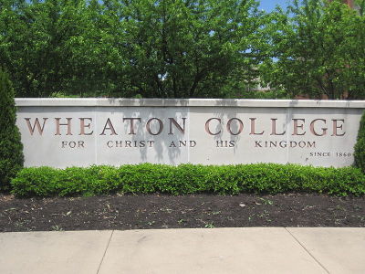 The sign on the campus of Wheaton College display’s the Illinois evangelical institution’s motto.