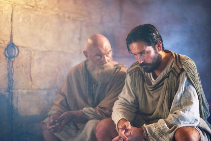L to R: Paul (James Faulkner) reminds Luke (Jim Caviezel) that love is the only way in PAUL, APOSTLE OF CHRIST--in theaters March 23, 2018.