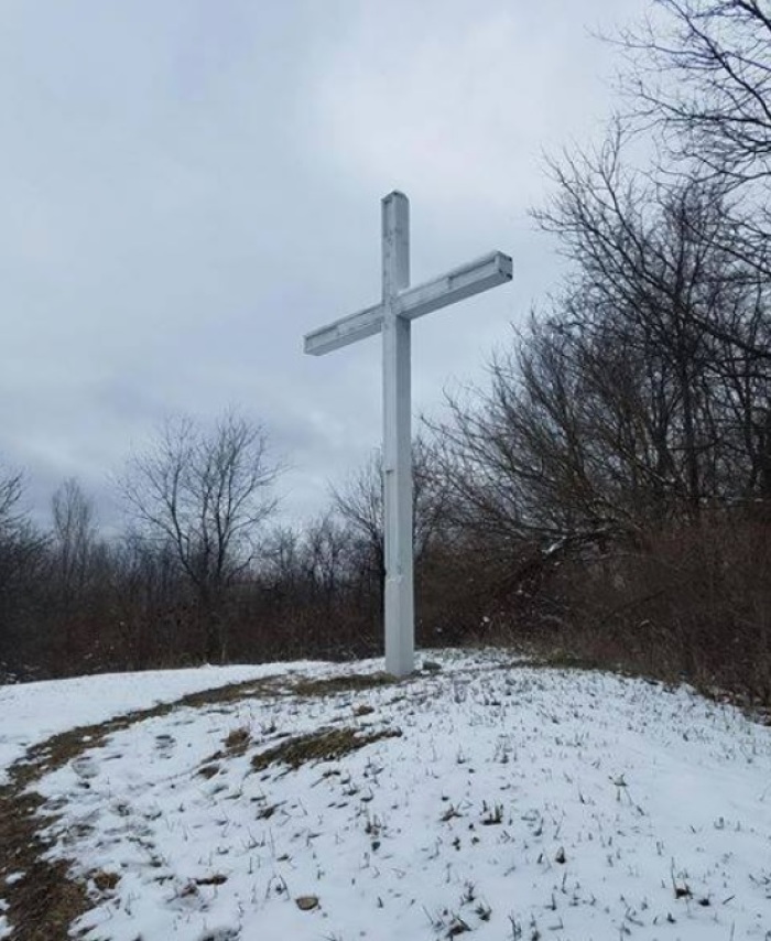 A large white cross located on Sackrider Hill in the Waterloo Recreation Area in Chelsea, Michigan.