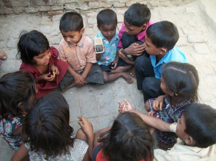 Children in India from a Hindu background gather round to hear about Jesus on The Treasure, a solar-powered audio Bible distributed by World Mission (www.worldmission.cc), one of the organizations championing the International Day for the Unreached (www.dayfortheunreached.org) that is calling for a greater focus on those who have yet to hear the gospel.''