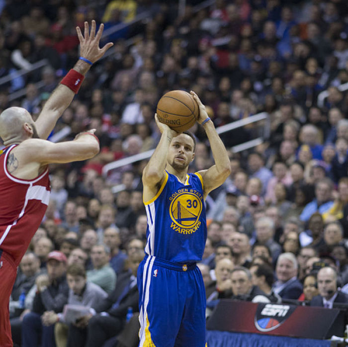 The Golden State Warriors' Steph Curry attempts a jumper against the Washington Wizards