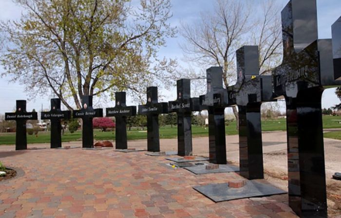 A single daffodil was left on each memorial cross in remembrance of the 13 victims at Olingers Cemetery's Columbine Memorial Garden. Each cross bears a picture of the person killed in Littleton, Colorado. Photo taken on April 15, 2004.