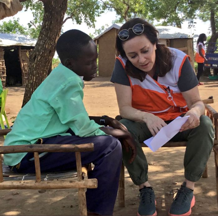 Actress Patricia Heaton reads prayers to a South Sudanese refugee child named Victor during a trip to Uganda in April 2018 with the evangelical humanitarian group World Vision.