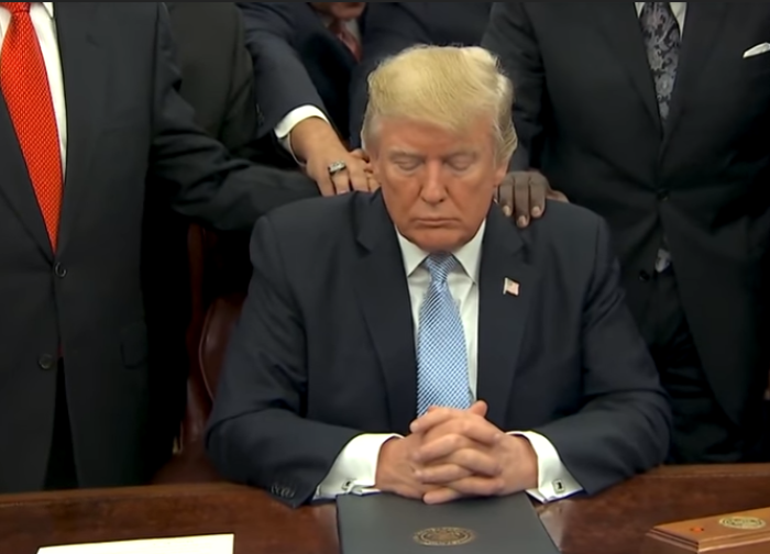 President Donald Trump receives prayer from evangelical pastors at the White House.