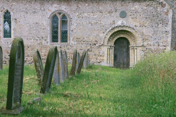 The magnificent Norman-style north doorway of St. Margaret's Church in Hales, England.