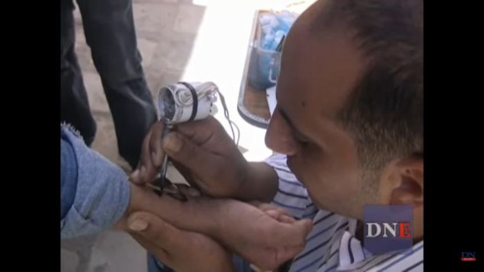 Christians getting marked with tattoos in the alleys of Coptic Cairo, Egypt, in this video uploaded on July 2, 2009.
