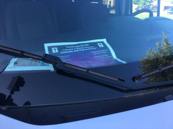 Christian pamphlets on the dashboard of a van outside the home 67-year-old lead pastor of Oxon Hill Assembly of Jesus Christ Joshua William Wright on Wednesday May 23, 2018.