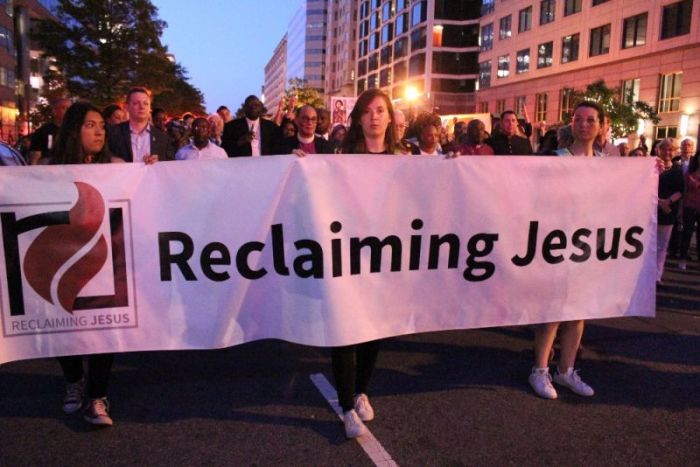 Hundreds of Christians march in a procession from the National City Church to the White House in Washington, D.C. on May 24, 2018 in response to racism, misogyny, xenophobia, and moral and political 'crises' affecting political leadership.