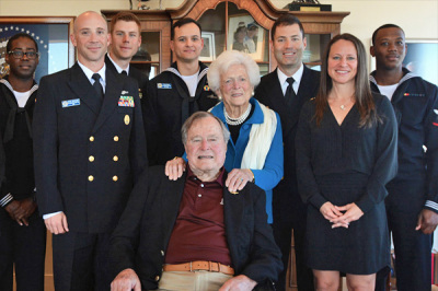 Sailors and representatives from the USS Houston visit with former President George H.W. Bush and his wife Barbara Bush in Houston, Feb. 25, 2016.
