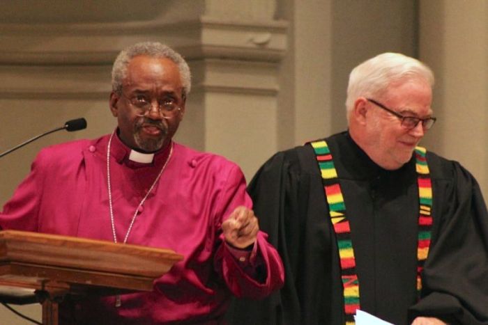 Episcopal Church Presiding Bishop Michael Curry speaks during a prayer service unveiling the new declaration 'Reclaiming Jesus: A Confession of Faith in a Time of Crisis' at the National City Church in Washington, D.C. on May 24, 2018. Curry is flanked by Sojourners founder Jim Wallis.