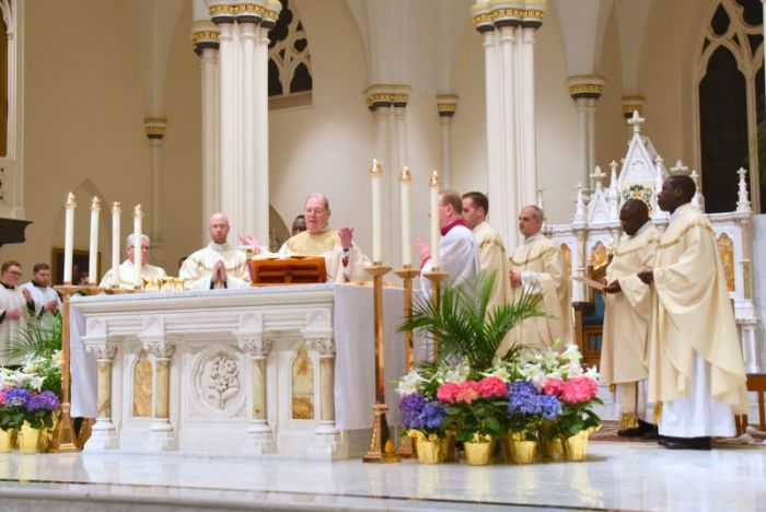 Bishop Robert Deeley participates in a mass at a church in the Roman Catholic Diocese of Portland, Maine in April 2018.