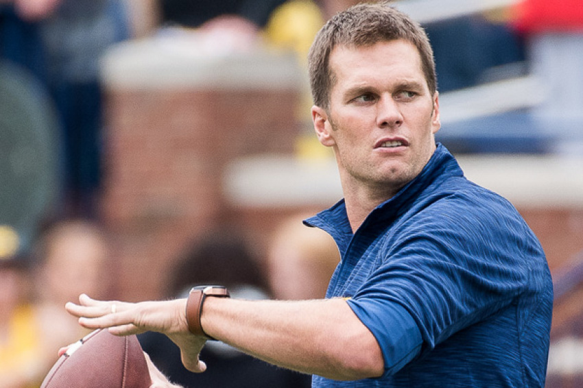 Tom Brady throwing to Jim Harbaugh before 2016 Michigan Wolverines football team's 45-28 victory over 2016 Colorado Buffaloes football team at Michigan Stadium on September 17, 2016.