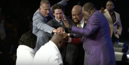 Relentless Church Pastor John Gray gets prayed over during installation service, June 3, 2018.