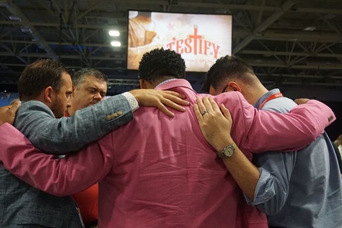 Messengers pray together at the Southern Baptist Convention's Annual Meeting at the Kay Bailey Hutchison Convention Center in Dallas, Texas, on June 13, 2018.