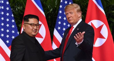 President Trump and Chairman Kim greet one another at summit