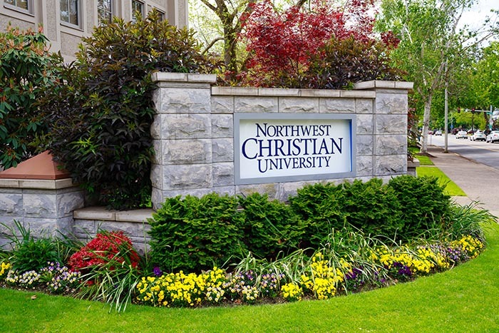 EUGENE, OR: Sign for Northwest Christian College next to the University of Oregon.
