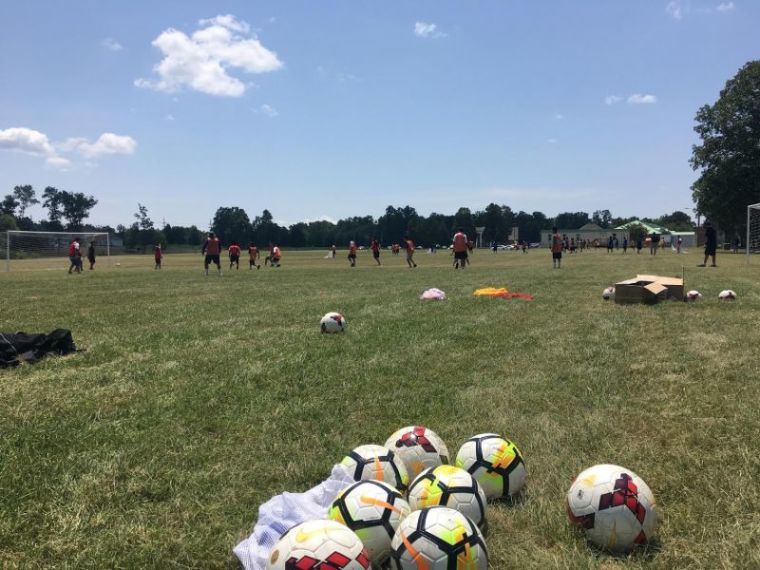 Children participate in a Liberty University soccer clinic at the Youth for Tomorrow residential facility in Bristow, Virginia on July 13, 2018.